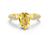 Yellow gold Pear Cut Diamond Solitaire Engagement Ring with Pavé Band and Four-Prong Setting