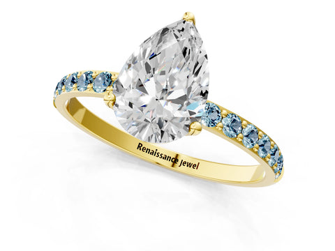 Yellow gold Pear Cut Diamond Solitaire Engagement Ring with Round with Aquamarine side stone Pavé Band and Prong Setting_1