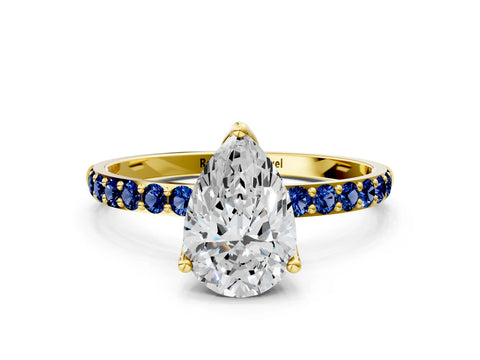 Yellow gold Pear Cut Diamond Solitaire Engagement Ring with Round with Blue Sapphire side stone Pavé Band and Prong Setting