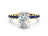 Yellow gold Pear Cut Diamond Solitaire Ring with Pavé Band and Four-Prong Setting