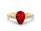 Yellow gold Pear Cut Diamond Solitaire Ring with Pavé Band and Prong Setting