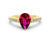 Yellow gold Pear Cut Diamond Solitaire Ring with Pavé Band and Prong Setting