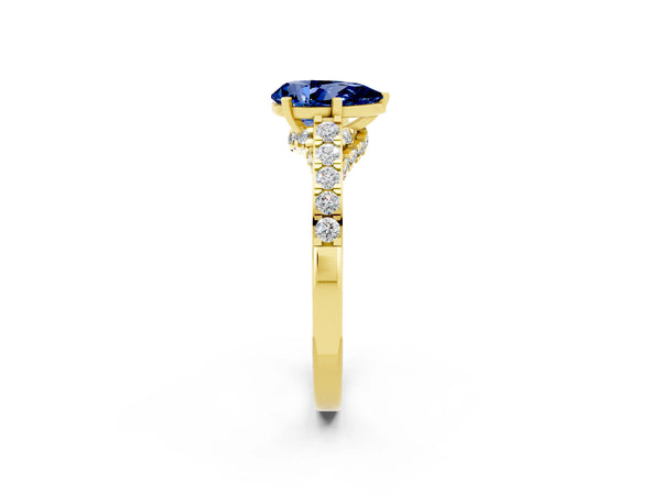 Yellow gold Pear Cut Blue Sapphire Solitaire Ring with Crossover Gallery and Round  Pavé Band