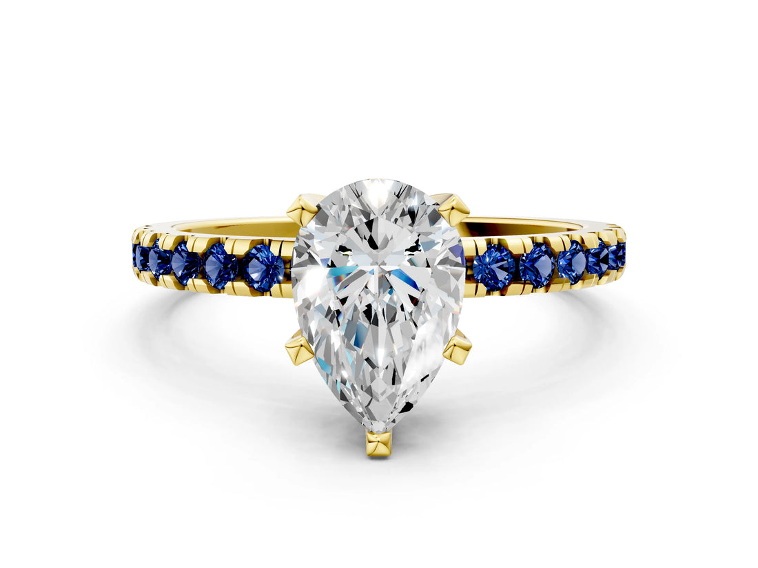 Yellow gold Pear Cut Diamond Solitaire Ring with Round with Blue Sapphire side stone Pavé Band and Four-Prong Setting_36