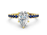 Yellow gold Pear Cut Diamond Solitaire Ring with Round with Blue Sapphire side stone Pavé Band and Four-Prong Setting_36