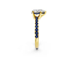 Yellow gold Pear Cut Diamond Solitaire Ring with Round with Blue Sapphire side stone Pavé Band and Four-Prong Setting_38