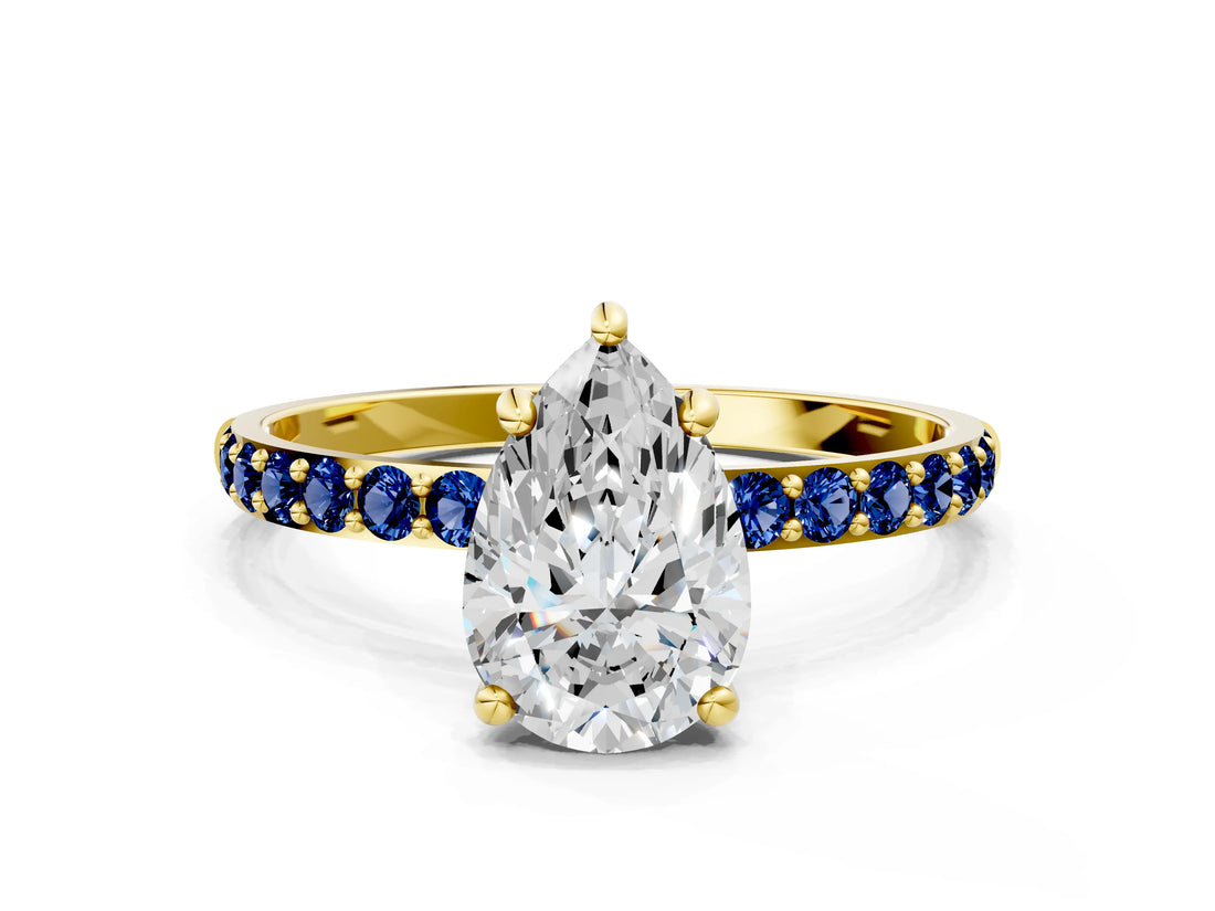 Yellow gold Pear Cut Diamond Solitaire Ring with Round with Blue Sapphire side stone Pavé Band and Prong Setting_12