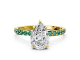 Yellow gold Pear Cut Diamond Solitaire Ring with Round with Green Sapphire side stone Pavé Band and Prong Setting
