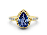 Yellow gold Pear Cut Diamond Solitaire Ring with Shared Prong Pavé Band