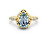 Yellow gold Pear Cut Diamond Solitaire Ring with Shared Prong Pavé Band