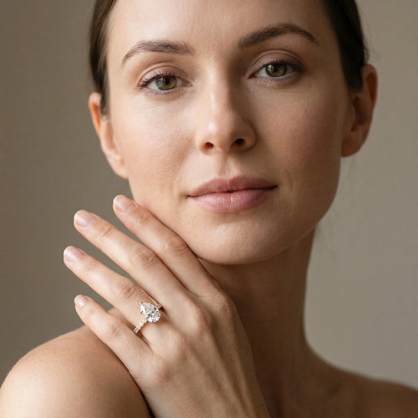 Yellow gold Pear Cut Diamond Solitaire Ring with U-Prong Diamond Band and Four Prong Setting