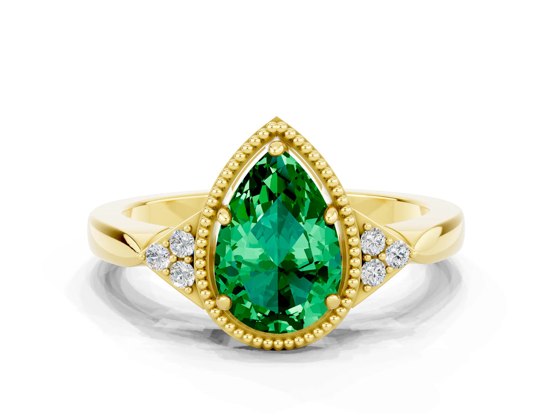 Yellow gold Pear Cut Emerald Halo Ring with Tapered Band and Four-Prong Setting
