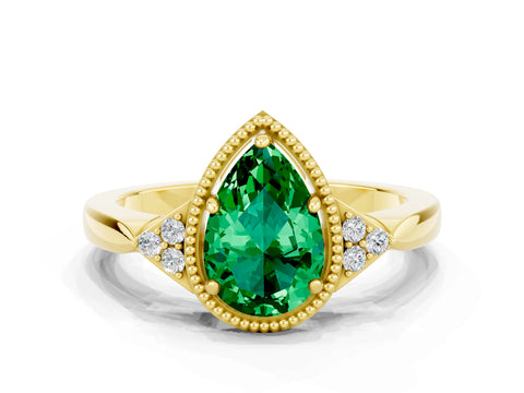 Yellow gold Pear Cut Emerald Halo Ring with Tapered Band and Four-Prong Setting