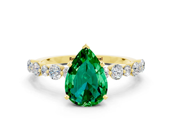 Yellow gold Pear Cut Emerald Prong Set Engagement Ring with Pavé Band