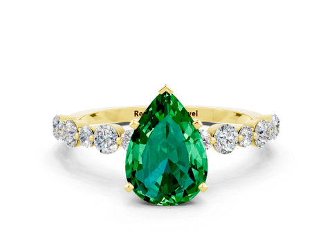 Yellow gold Pear Cut Emerald Prong Set Engagement Ring with Pavé Band