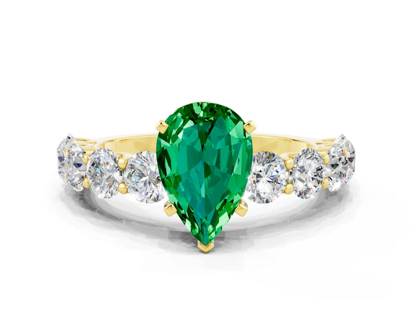 Yellow gold Pear Cut Emerald Prong Setting with Side Stones on a Pave Band