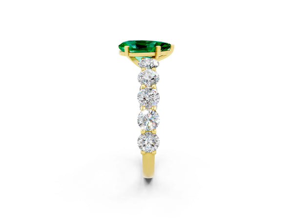 Yellow gold Pear Cut Emerald Prong Setting with Side Stones on a Pave Band