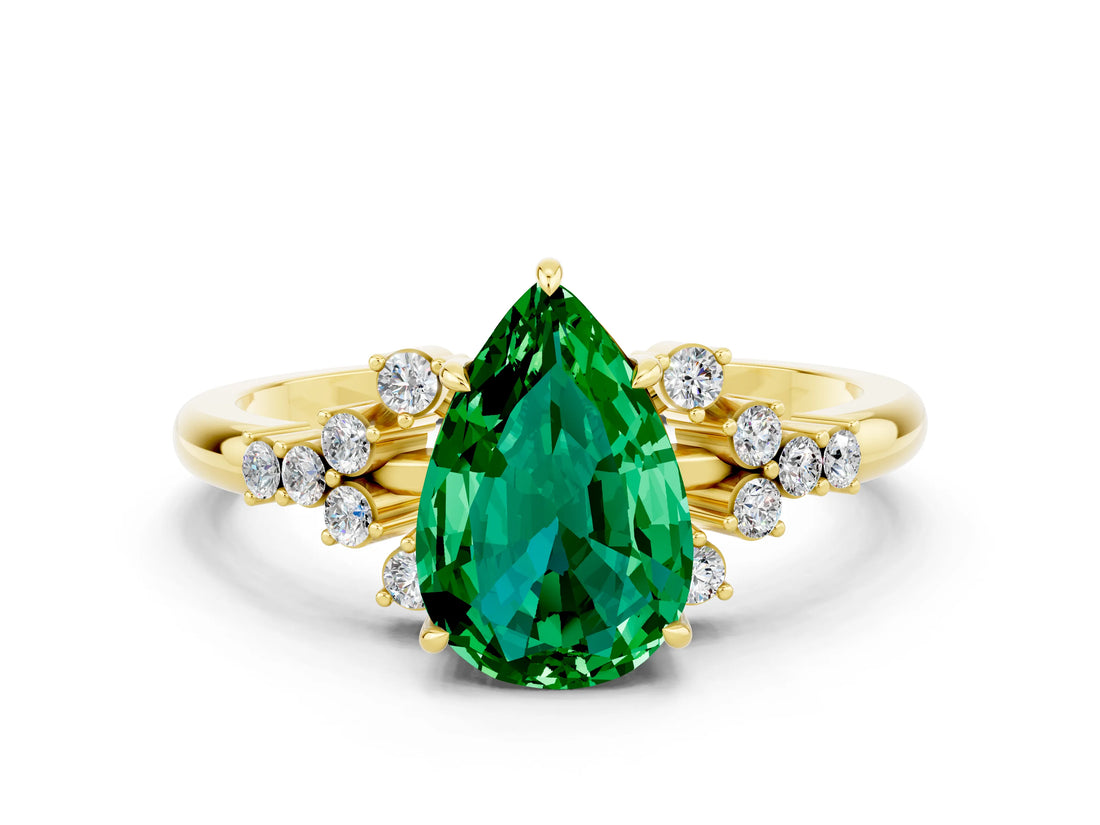 Yellow gold Pear Cut Emerald Ring with Side Stones and Four-Prong Setting_36