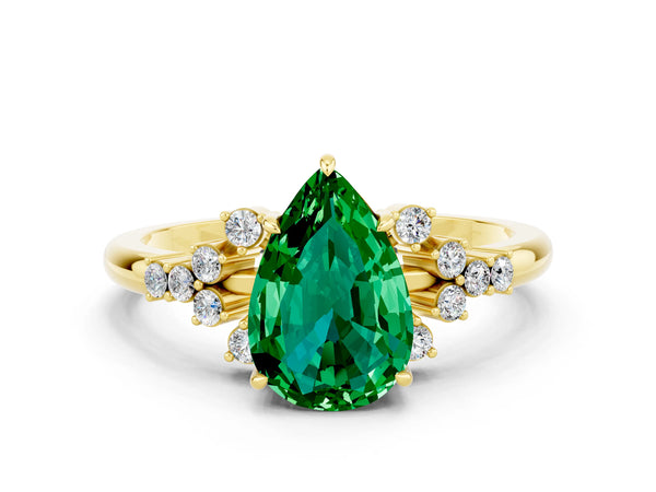 Yellow gold Pear Cut Emerald Ring with Side Stones and Four-Prong Setting