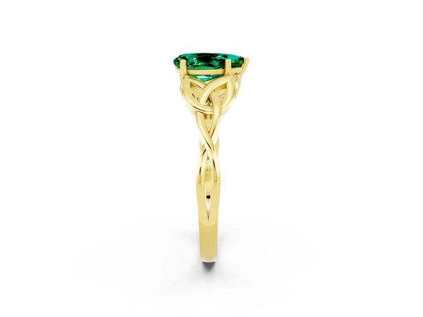 Yellow gold Pear Cut Emerald Solitaire Engagement Ring with Celtic Knot Band and Four-Prong Setting