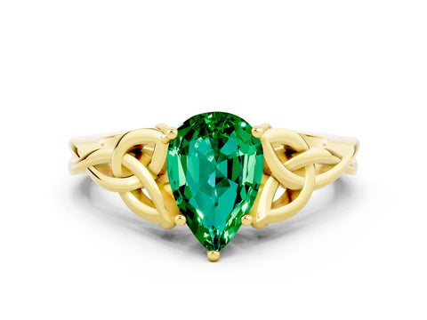 Yellow gold Pear Cut Emerald Solitaire Engagement Ring with Celtic Knot Band and Four-Prong Setting