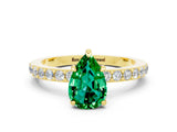 Yellow gold Pear Cut Emerald Solitaire Engagement Ring with Pavé Band and Four-Prong Setting