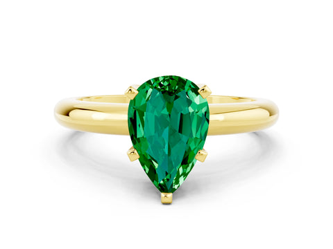 Yellow gold Pear Cut Emerald Solitaire Engagement Ring with Round Band and Four-Prong Setting