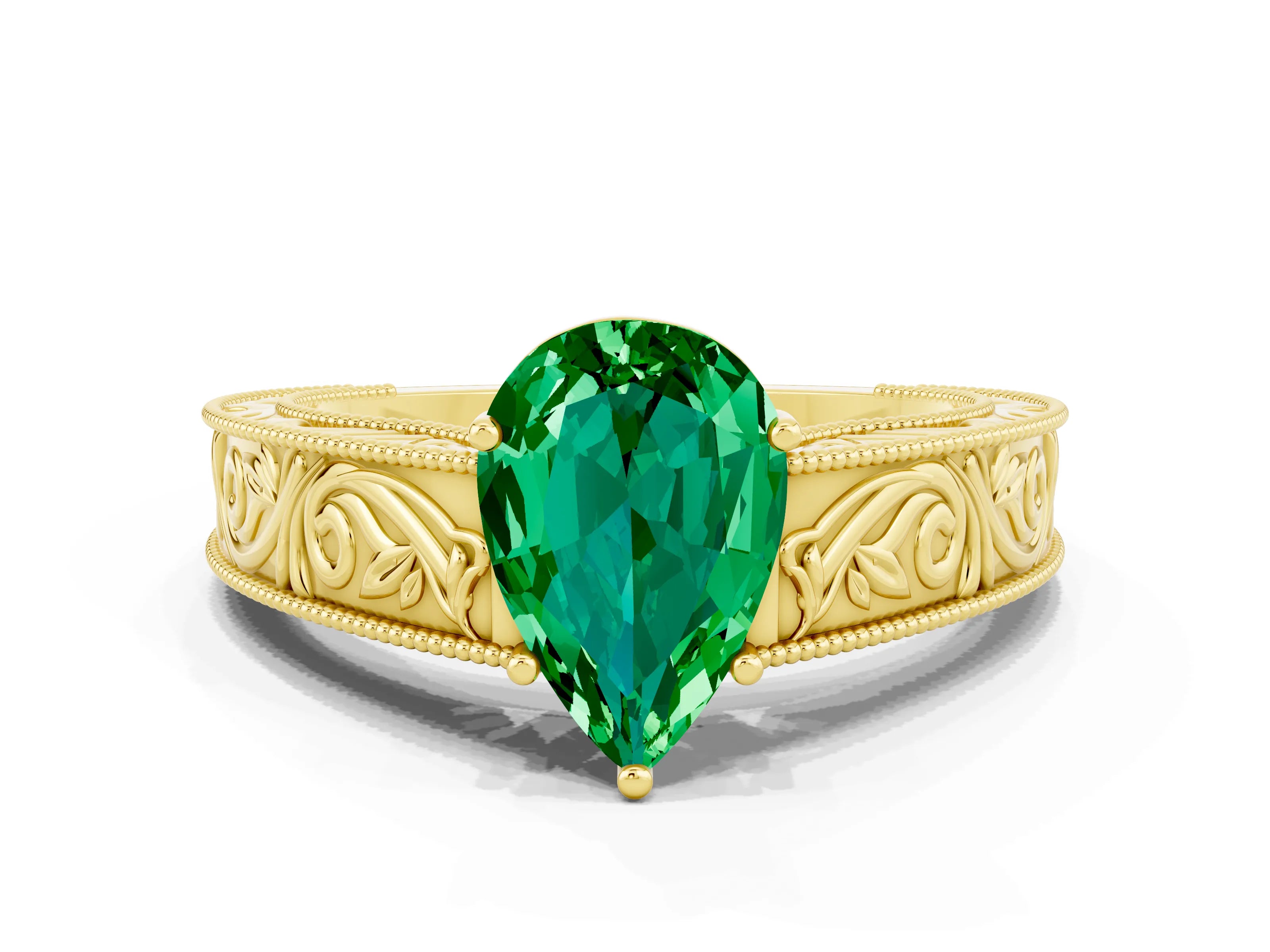 Yellow gold Pear Cut Emerald Solitaire Ring with Engraved Band and Four-Prong Setting