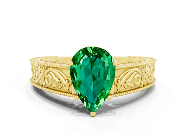Yellow gold Pear Cut Emerald Solitaire Ring with Engraved Band and Four-Prong Setting