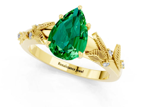 Yellow gold Pear Cut Emerald Solitaire Ring with Leaf Motif Band and Four-Prong Setting_1
