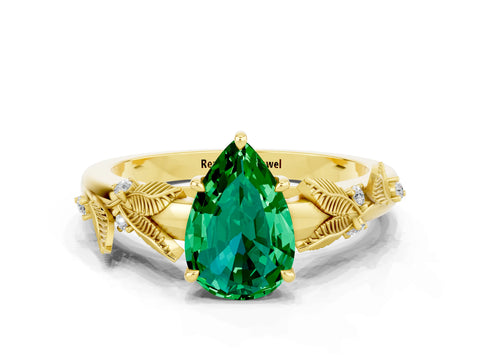 Yellow gold Pear Cut Emerald Solitaire Ring with Leaf Motif Band and Four-Prong Setting