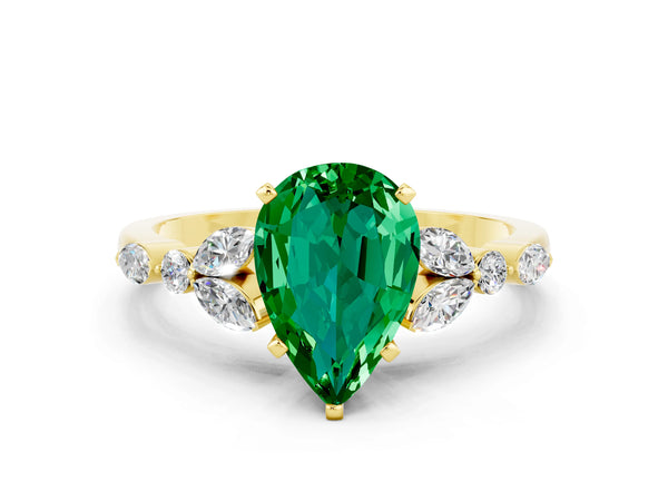 Yellow gold Pear Cut Emerald Solitaire Ring with Side Stones and Four-Prong Setting