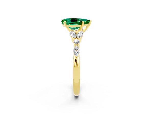 Yellow gold Pear Cut Emerald Solitaire Ring with Side Stones and Four-Prong Setting