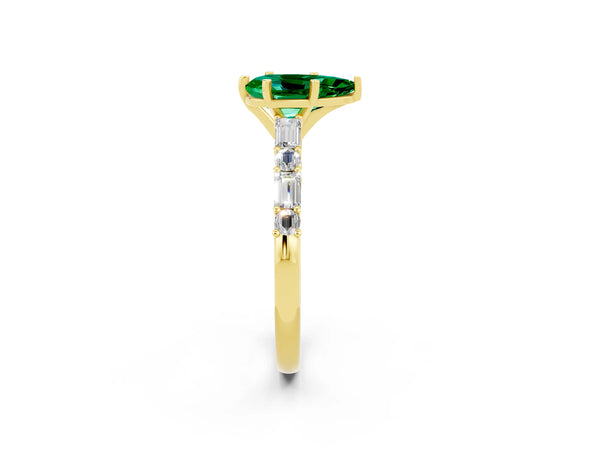 Yellow gold Pear Cut Emerald Solitaire with Side Baguettes and Channel Set Band