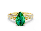Yellow gold Pear Cut Emerald Split Shank Engagement Ring with Pavé Band