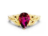Yellow gold Pear Cut Garnet Solitaire Engagement Ring with Celtic Knot Band and Four-Prong Setting