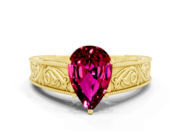 Yellow gold Pear Cut Garnet Solitaire Ring with Engraved Band and Four-Prong Setting