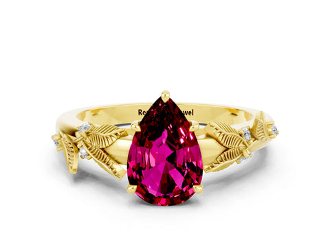 Yellow gold Pear Cut Garnet Solitaire Ring with Leaf Motif Band and Four-Prong Setting