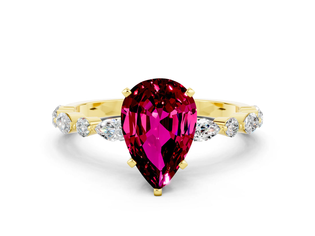 Yellow gold Pear Cut Garnet Solitaire with Side Stones on a Pavé Band and Four-Prong Setting