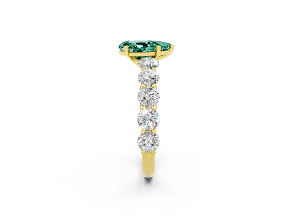 Yellow gold Pear Cut Green Sapphire Prong Setting with Side Stones on a Pave Band