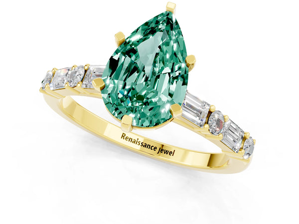 Yellow gold Pear Cut Green Sapphire Solitaire with Side Baguettes and Channel Set Band