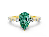 Yellow gold Pear Cut Green Sapphire Solitaire with Side Stones on a Pavé Band and Four-Prong Setting
