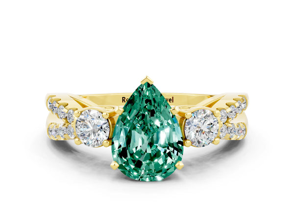 Yellow gold Pear Cut Green Sapphire Three-Stone Ring with Pavé Split Shank and Four-Prong Setting