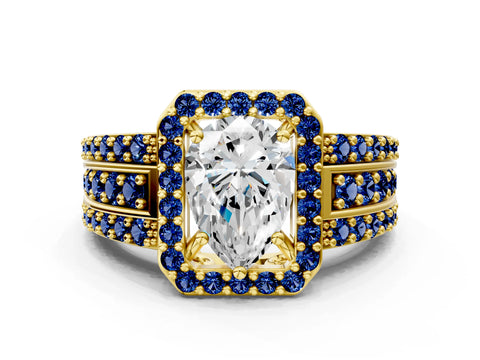 Yellow gold Pear Cut Halo Diamond Ring with Round with Blue Sapphire side stone Split Shank and Prong Setting