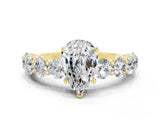 Yellow gold Pear Cut Moissanite Prong Setting with Side Stones on a Pave Band