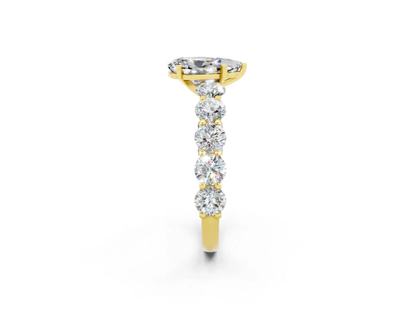 Yellow gold Pear Cut Moissanite Prong Setting with Side Stones on a Pave Band