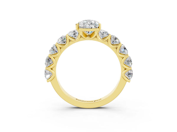 Yellow gold Pear Cut Moissanite Prong Setting with Side Stones on a Pave Band