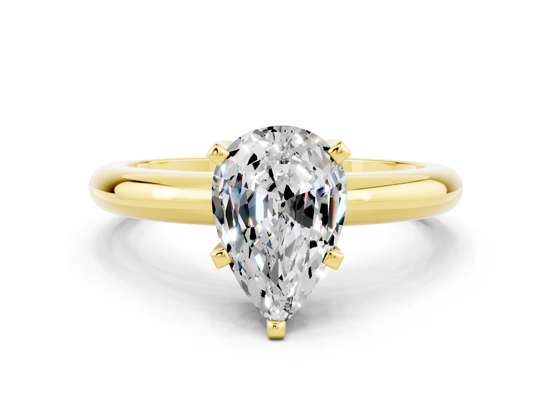 Yellow gold Pear Cut Moissanite Solitaire Engagement Ring with Round Band and Four-Prong Setting