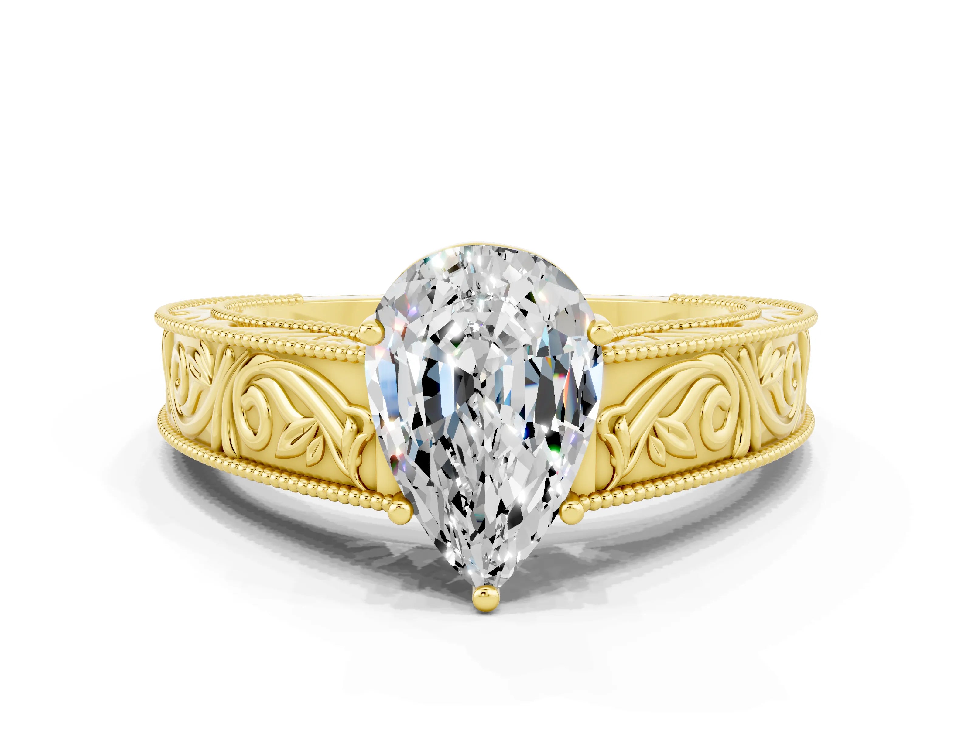 Yellow gold Pear Cut Moissanite Solitaire Ring with Engraved Band and Four-Prong Setting
