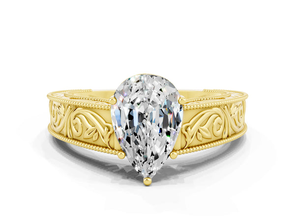 Yellow gold Pear Cut Moissanite Solitaire Ring with Engraved Band and Four-Prong Setting